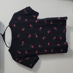 Black shirt with roses.